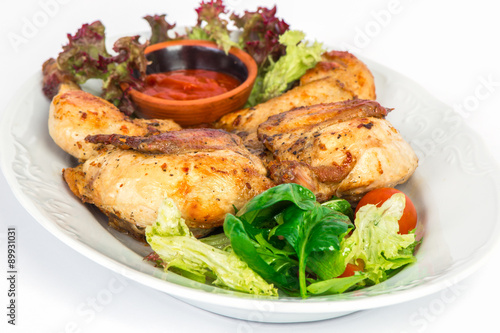 Grilled chicken on the plate with salad