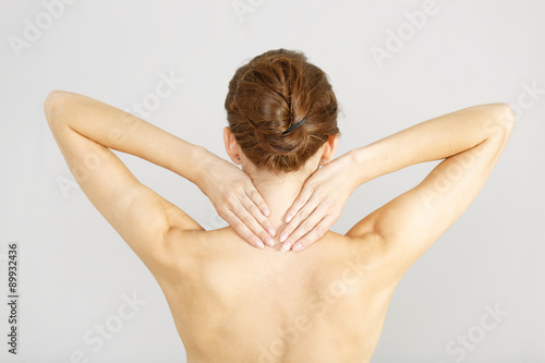 Woman with neck ache massaging