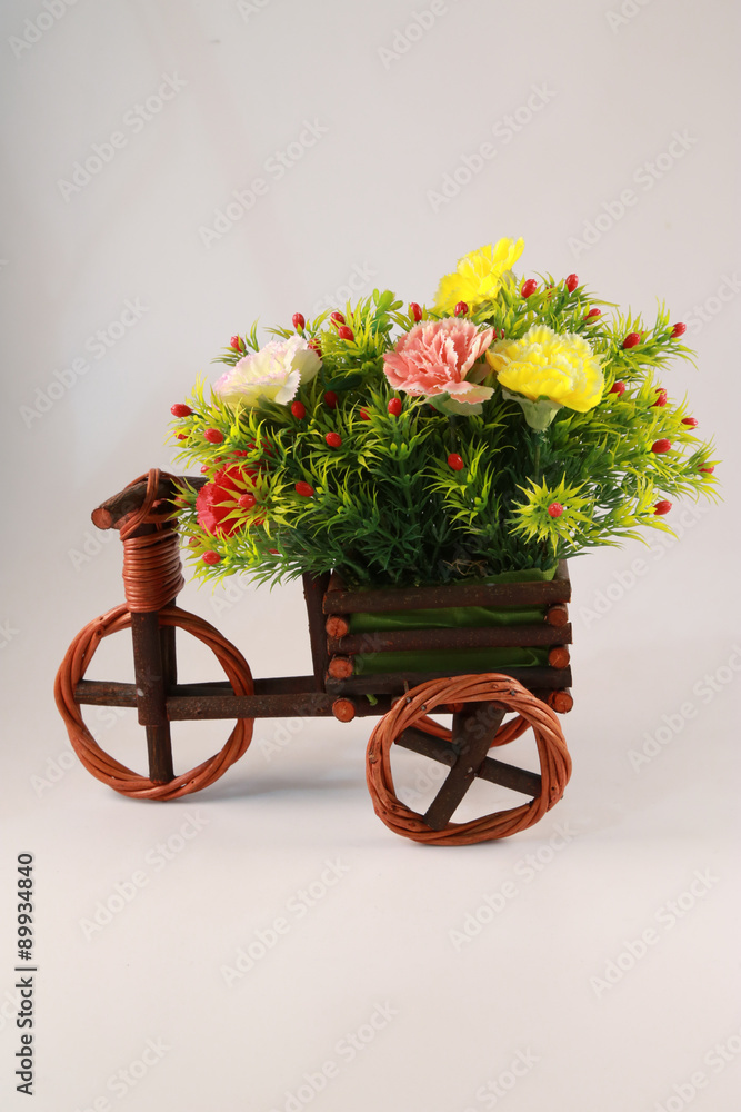 Beautiful and colorful flower bouquet in wooden basket in car sh