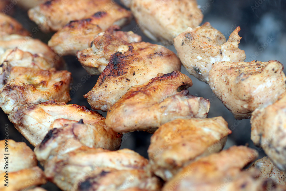 Chicken on the grill to cook