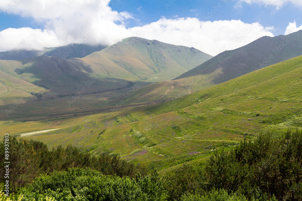 Caucasian mountains on a sunny summer day Caucasian mountains on a sunny summer day