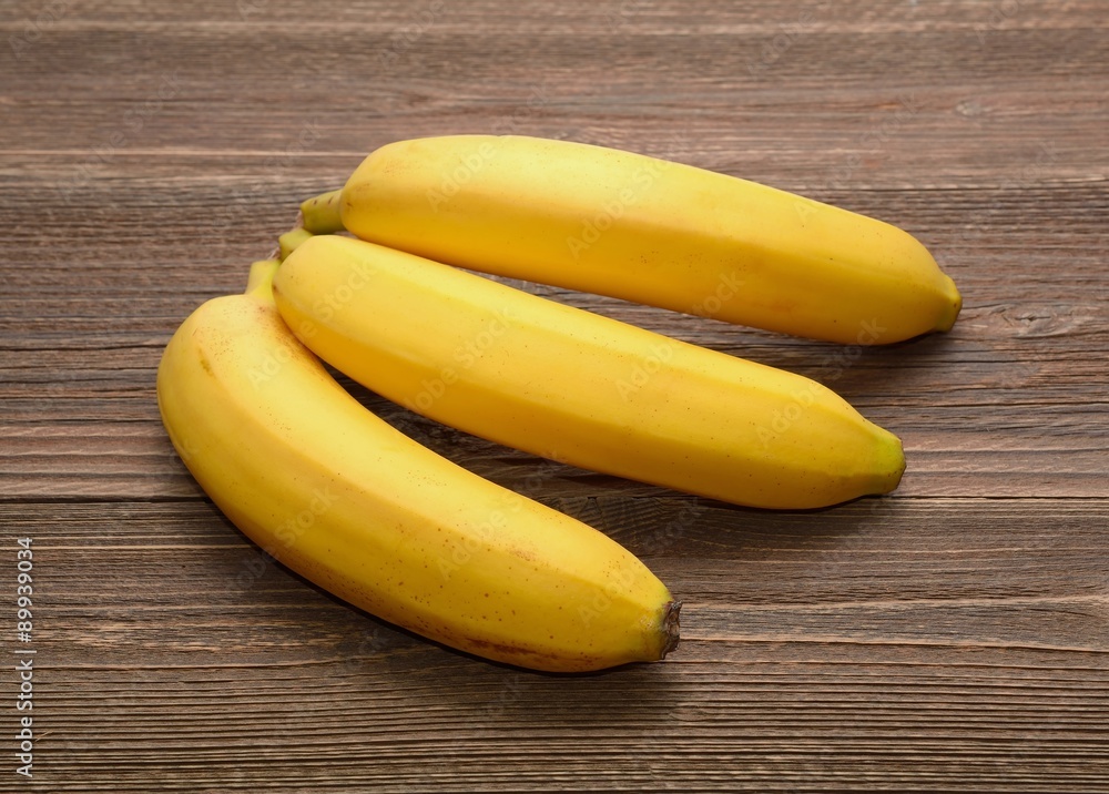 Fresh bananas on wooden background Fresh bananas on wooden background