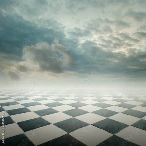 Billede på lærred chequered floor landscape with cloudy sky