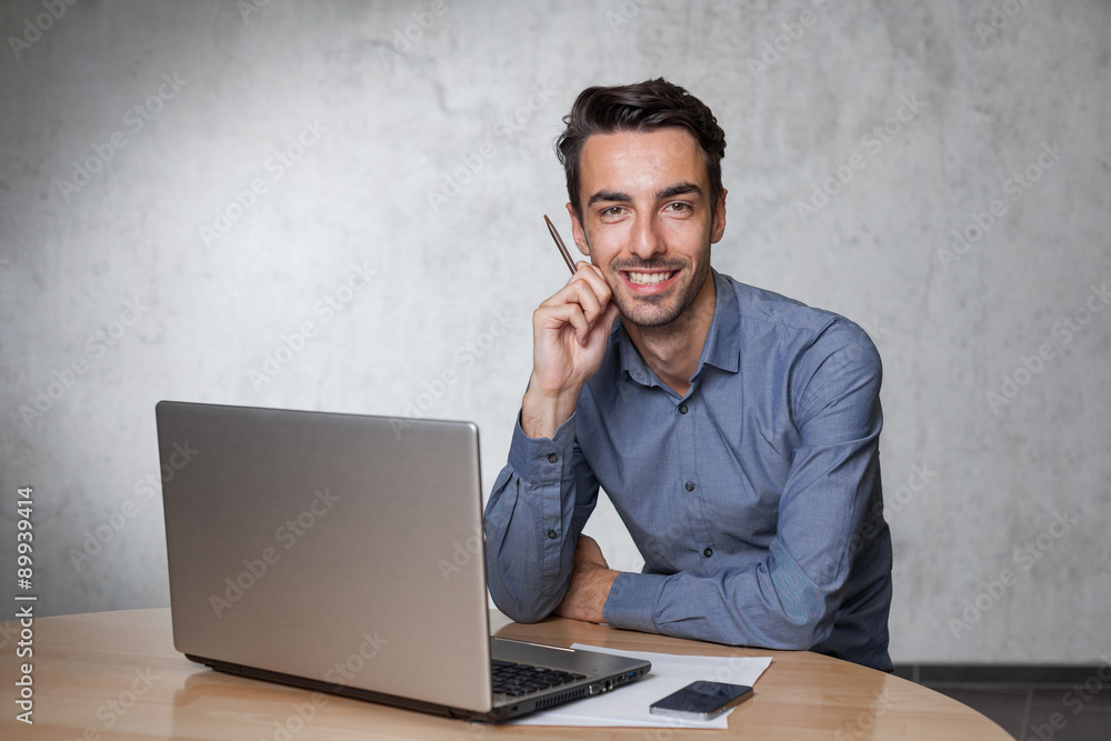 young working business man with pencil young working business man with pencil