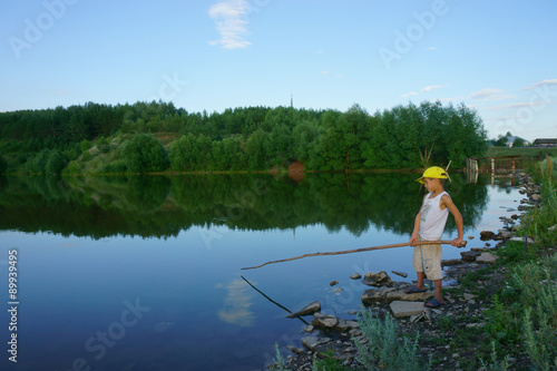 boy fishing on the lake