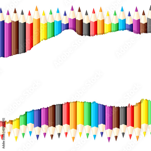 Paper sheet with ragged edge on background of colored pencils