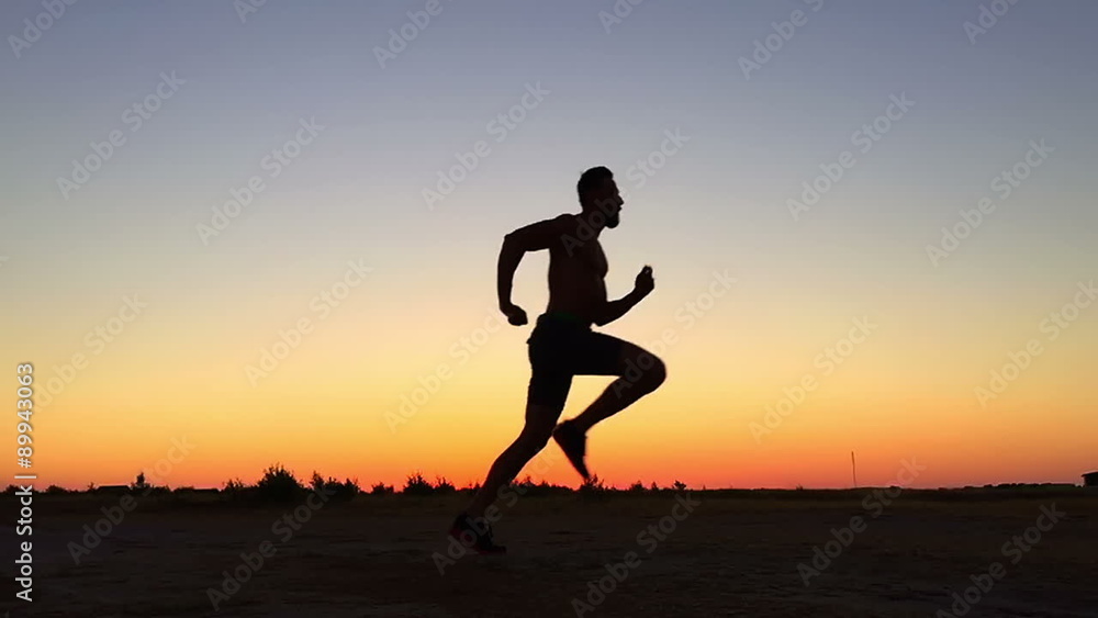 SLOV MOTION: Running man silhouette in sunset time SLOV MOTION: Running man silhouette in sunset time
