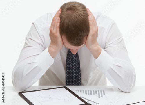 Wallpaper Mural Weary clerck sitting at the table, white background Torontodigital.ca