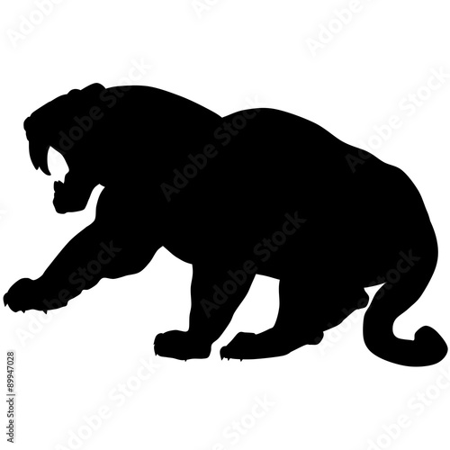 Fototapeta Naklejka Na Ścianę i Meble -  Vector silhouette of a black saber-tooth tiger