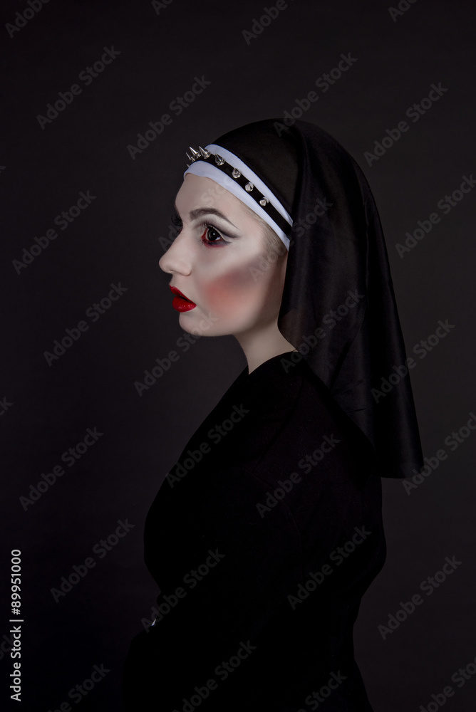 Halloween. Girl dressed in evil sexy nun Halloween. Girl dressed in evil sexy nun