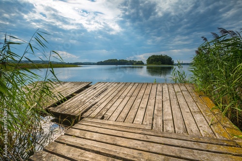 Fototapeta Naklejka Na Ścianę i Meble -  Beautiful lake with old destroyed jetty