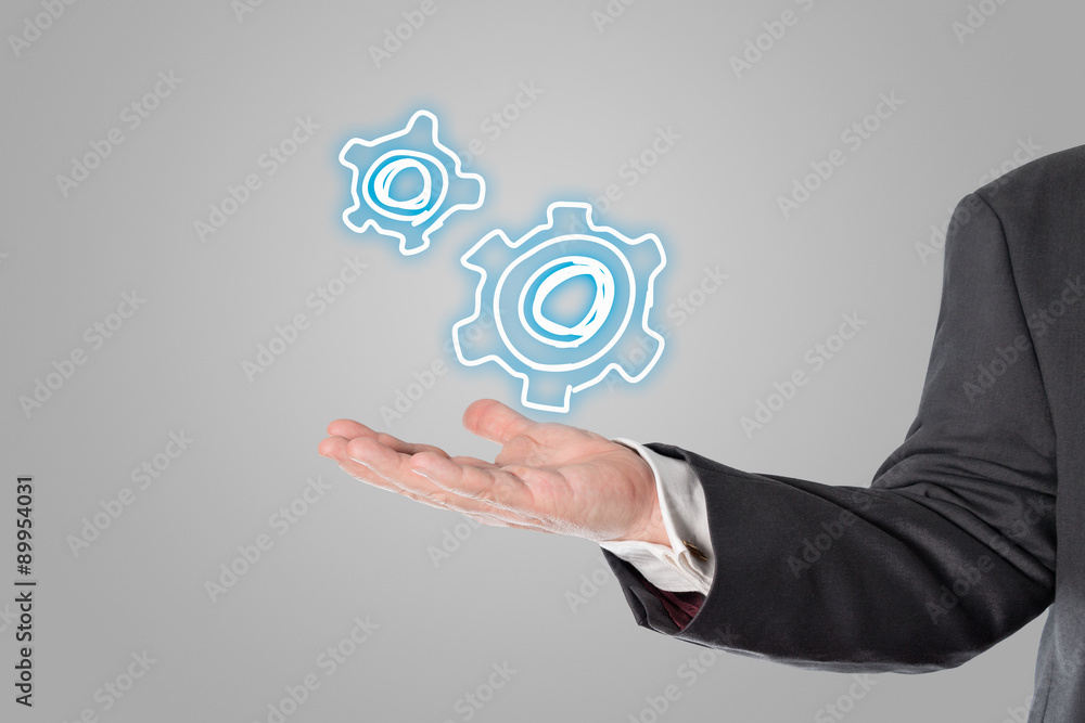 Businessman, salesman, gear symbol in the hand Businessman, salesman, gear symbol in the hand