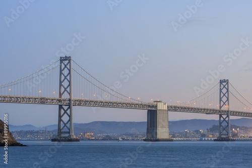 San Francisco     Oakland Bay Bridge with lights at sunset time