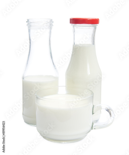 Milk bottle and milk glass on white background.