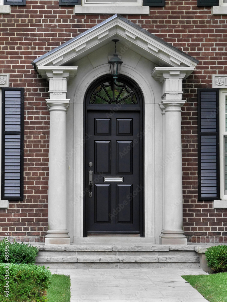 black front door with gable style portico