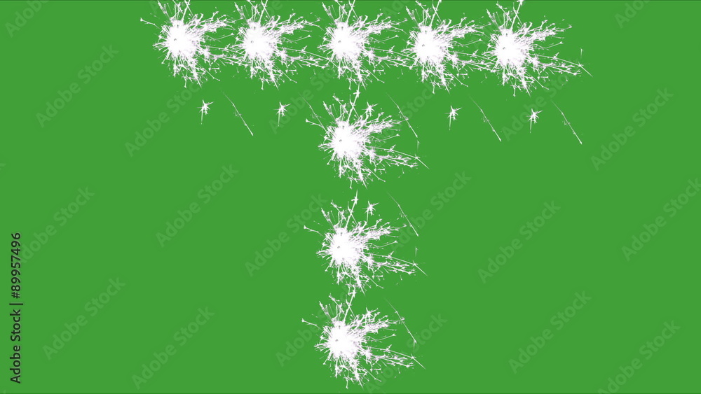 Capital letter T spelled with white sparklers on green screen. Capital letter T spelled with white sparklers on green screen.