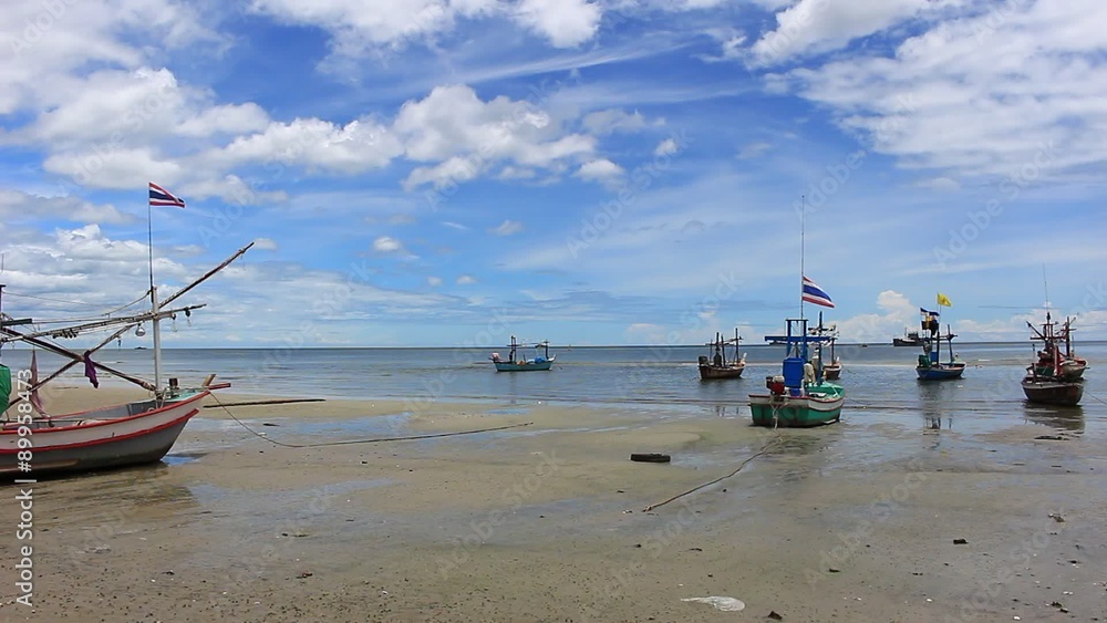 Prachuap Khiri Khan, Thailand-August 21,2015: Exotic tropical beach with fishing boats on sea coast at sunny summer day near Hua Hin district. Famous travel destination Prachuap Khiri Khan, Thailand-August 21,2015: Exotic tropical beach with fishing boats on sea coast at sunny summer day near Hua Hin district. Famous travel destination