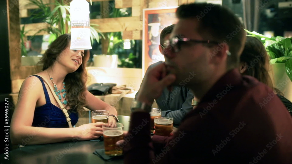 Friends relaxing in the pub and chatting, steadycam shot
Friends relaxing in the pub and chatting, steadycam shot