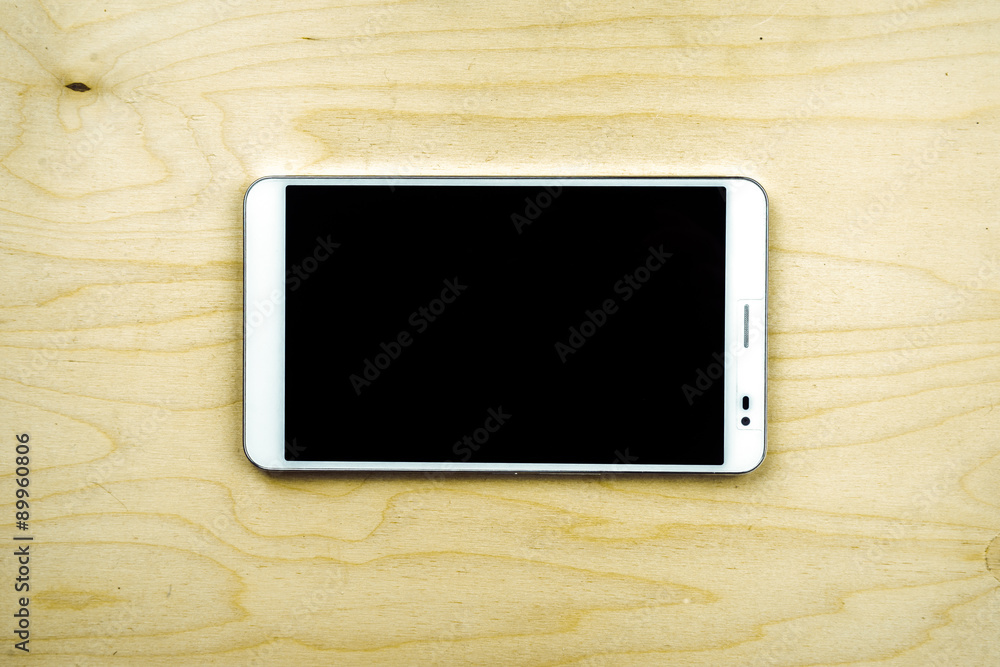 Tablet PC on wooden background Tablet PC on wooden background