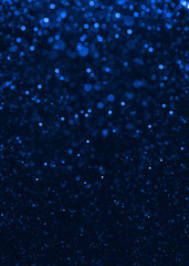 Blue sparkle glitter abstract background.