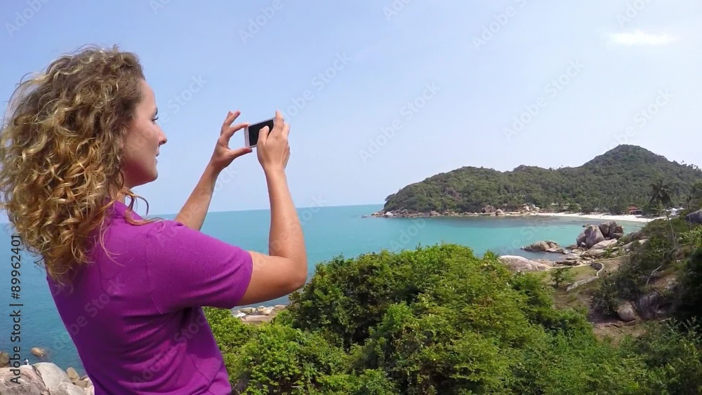 Happy Young Woman Using Phone Camera at Sea. Slow Motion. Happy Young Woman Using Phone Camera at Sea. Slow Motion.
