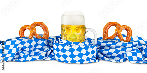 Oktoberfest beer mug and pretzel with bavarian flag isolated on white background photo