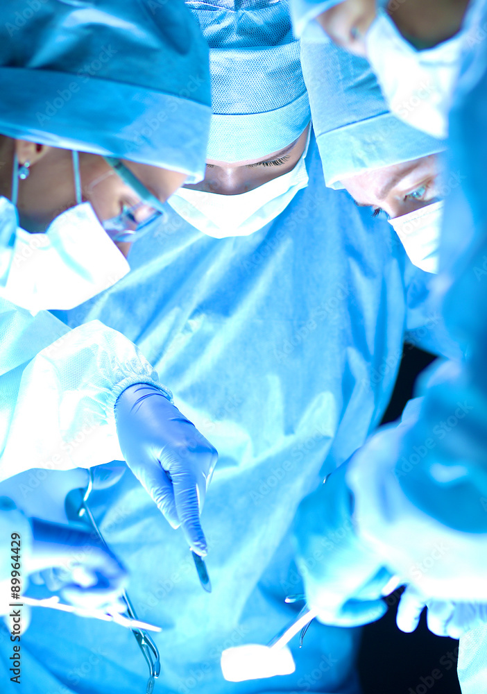 Fototapeta premium Woman dentist working at her patient teeth