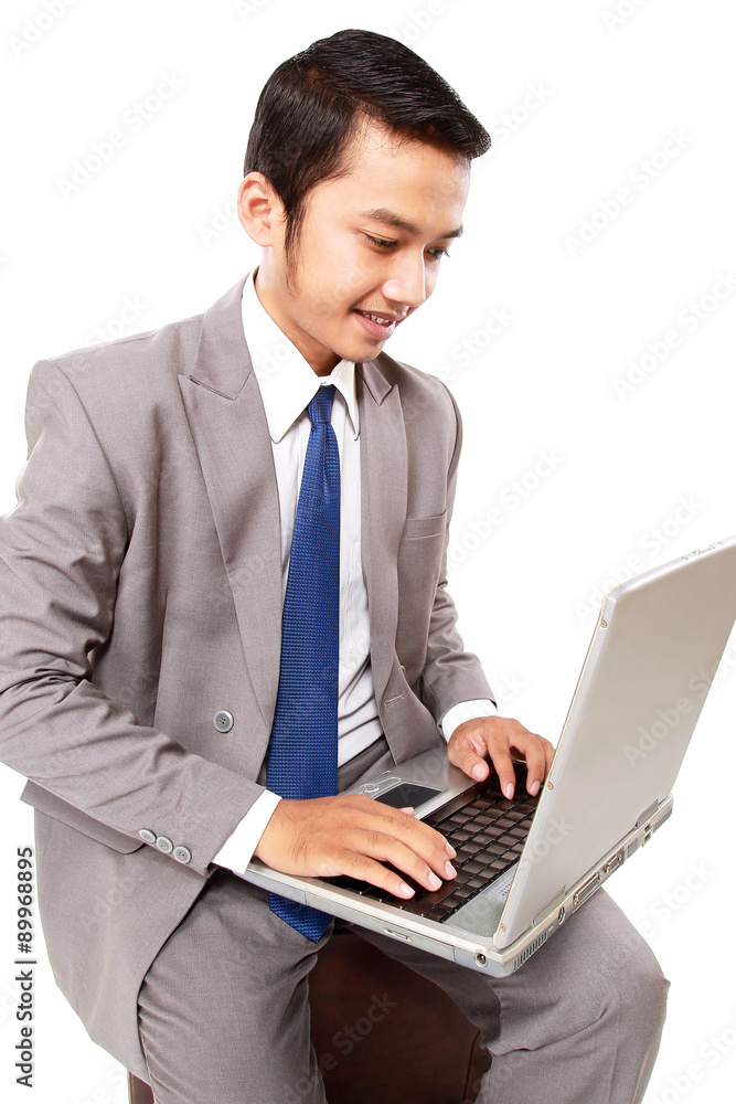 Portrait of smiling young businessman with laptop isolated on white background Portrait of smiling young businessman with laptop isolated on white background