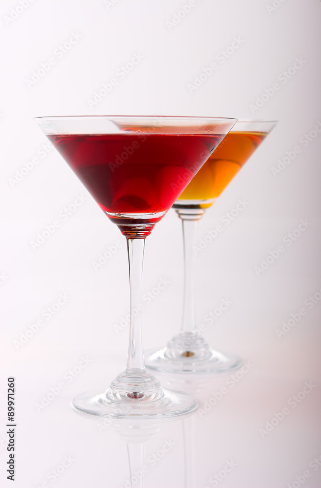 two various glasses of martini isolated on a white background two various glasses of martini isolated on a white background