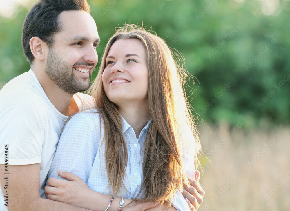 Fototapeta premium happy young couple outdoors in summer sunny day