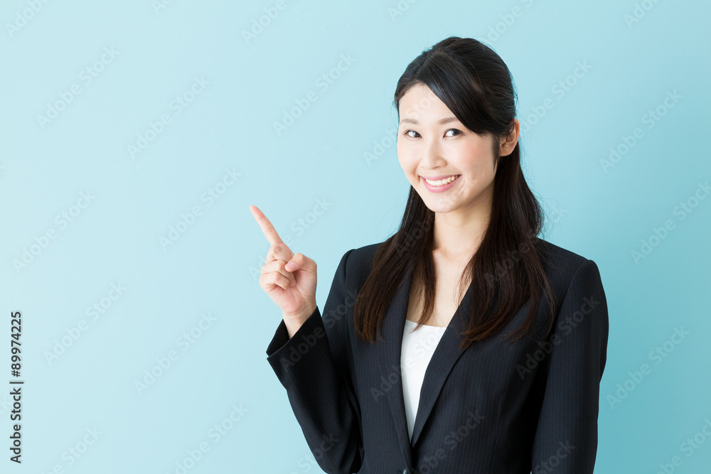 portrait of asian businesswoman on blue background portrait of asian businesswoman on blue background