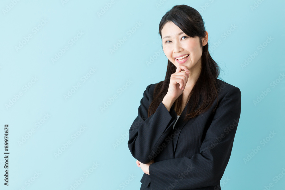 portrait of asian businesswoman on blue background portrait of asian businesswoman on blue background