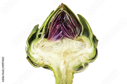 half artichoke, showing the heart and choke under the leaves, is