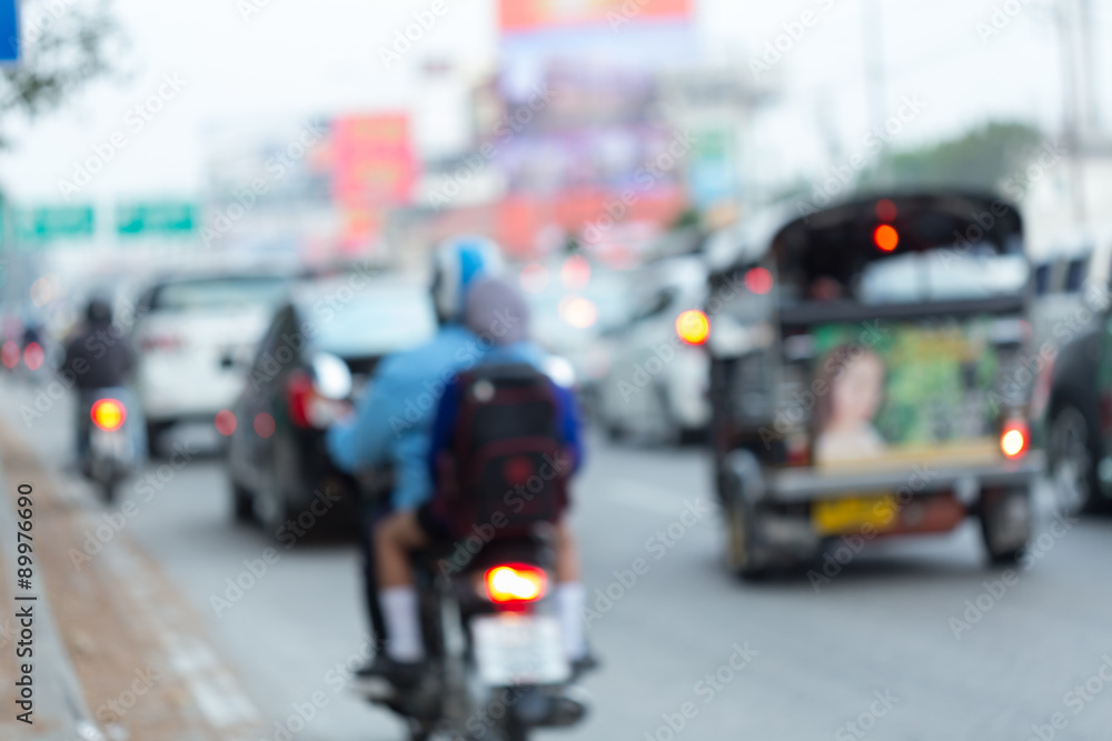 car and motorcycle driving on road with traffic jam in the city, abstract blurred car and motorcycle driving on road with traffic jam in the city, abstract blurred