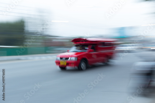 red car driving on road, chiang mai, thailand, abstract blurred