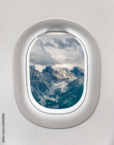 Looking out the window of a plane to the mountains in Georgia © andriano_cz