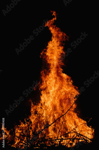 Pyramidal campfire on the dark background