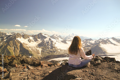 Thoughtful girl sitting on top of a mountain during a camping tr © tanu666a
