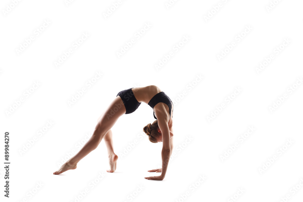 Girl doing exercise on stretching back muscles Girl doing exercise on stretching back muscles