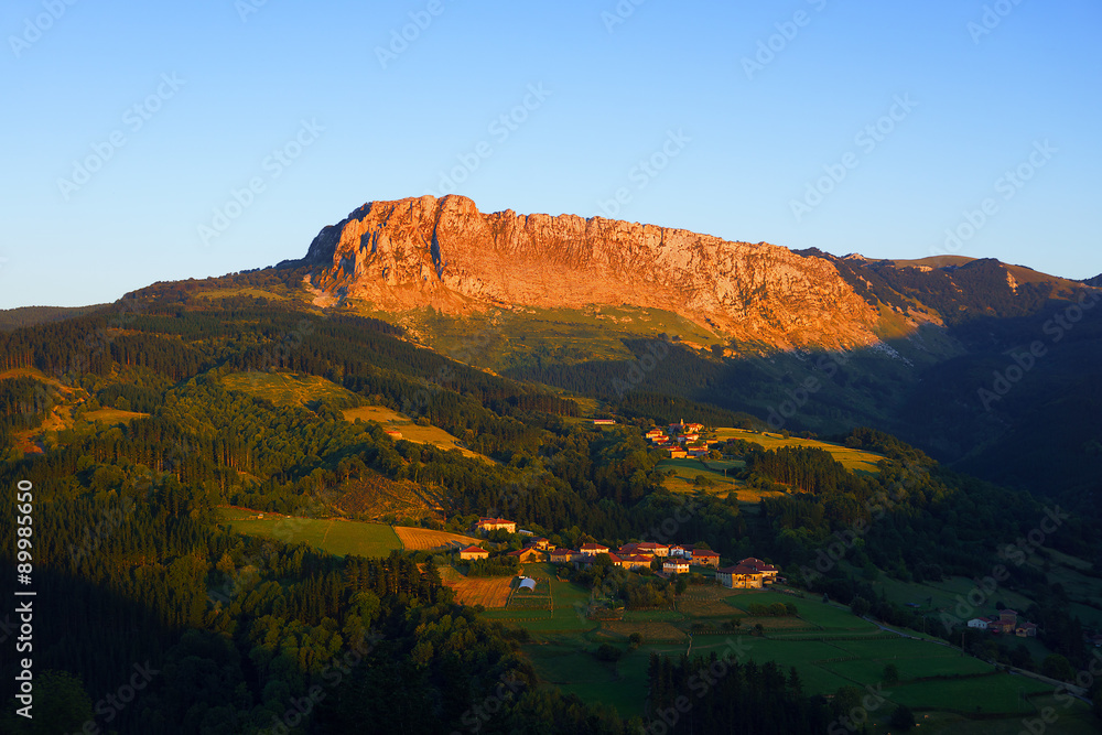 Itxina mountain with Zaloa and Urigoiti villages at sunset