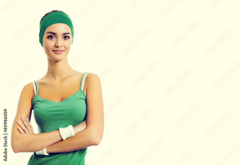 cheerful smiling young brunette woman in green fitness wear cheerful smiling young brunette woman in green fitness wear