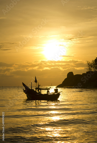 Small fishing boat on sea water ;  silhouette  style