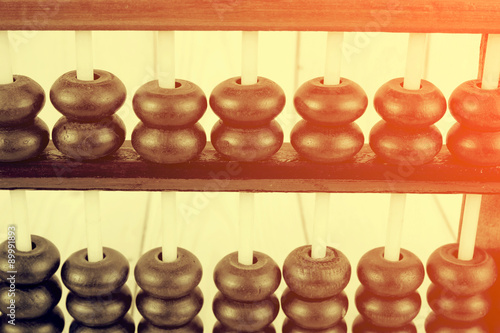 Vintage style - Close up of a wooden abacus beads. Selective foc