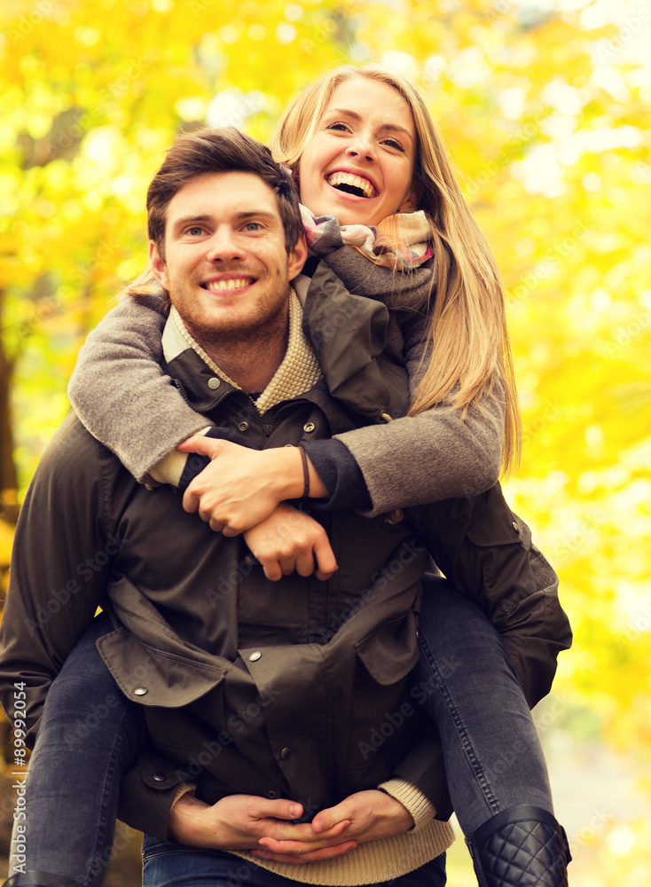 Fototapeta premium smiling friends having fun in autumn park