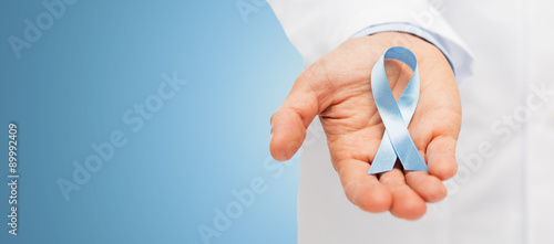 doctor hand with prostate cancer awareness ribbon photo