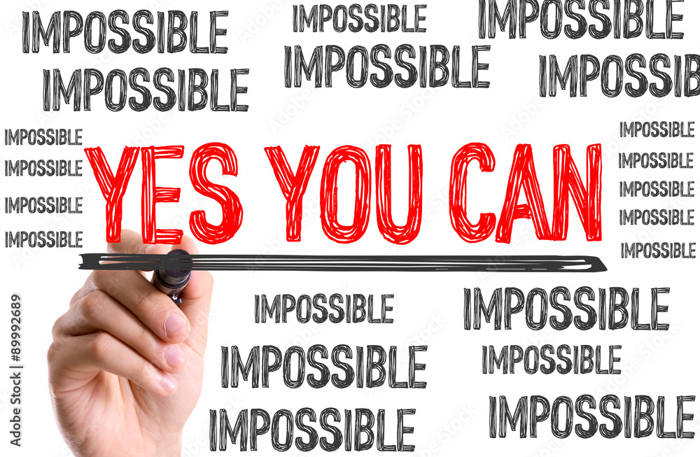 Hand with marker writing the word Yes You Can Hand with marker writing the word Yes You Can