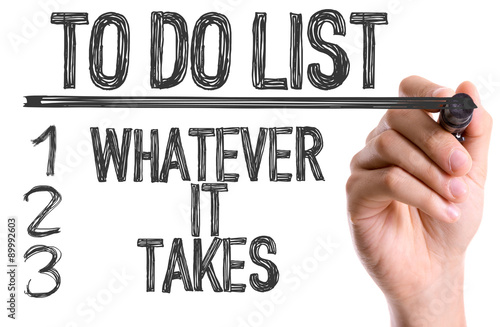 Hand with marker writing the text To Do List: Whatever It Takes
