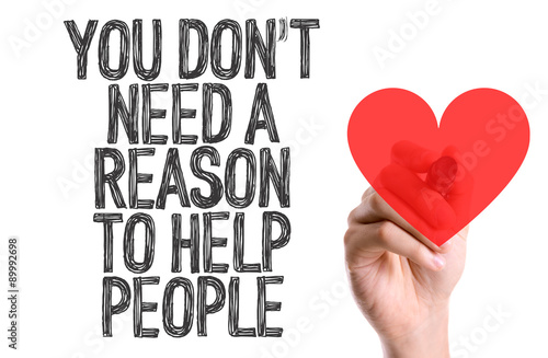 Photography Marker writing the word You Don't Need a Reason to Help People