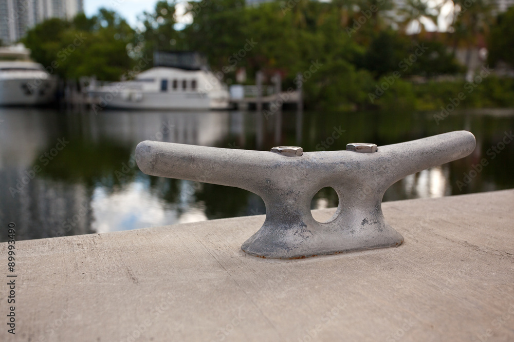 Metal cleat on a concrete dock