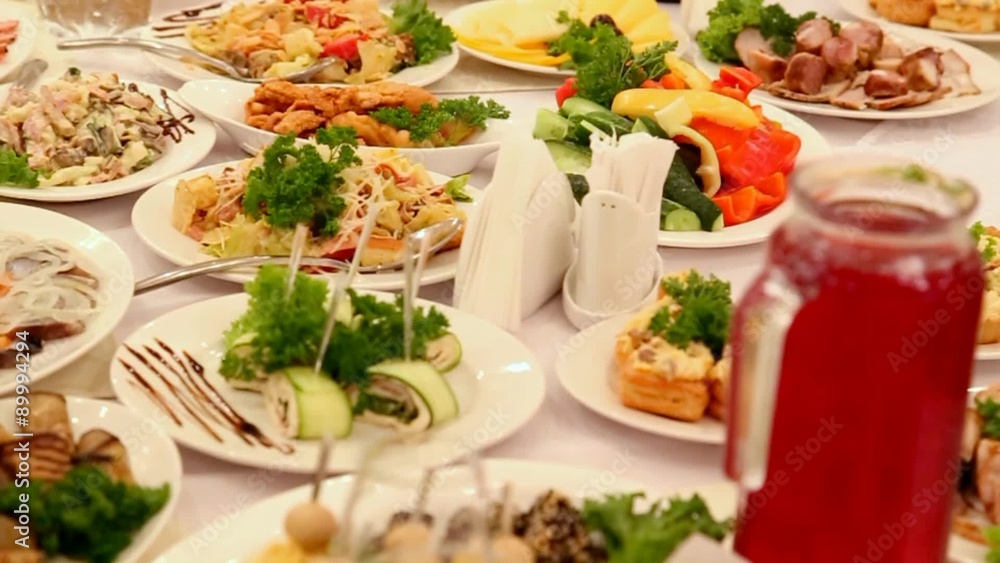 Table full of food. Served tables in restaurant. Table full of food. Served tables in restaurant.